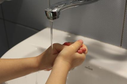 Washing hands in the sink