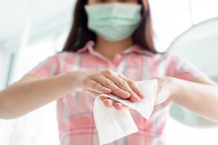 woman using hand wipes